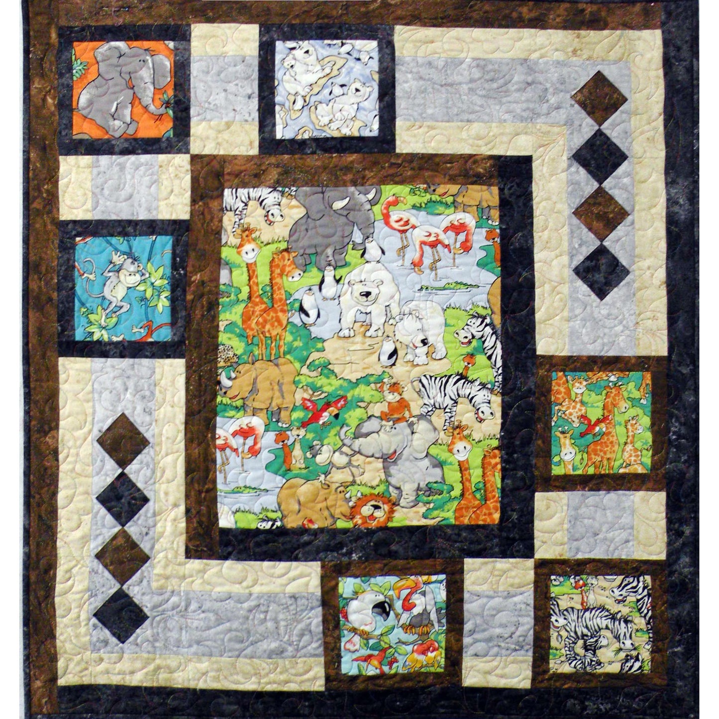 Zoo quilt features an animal print in the middle with lots of animals and blocks of animals in smaller blocks around it.
