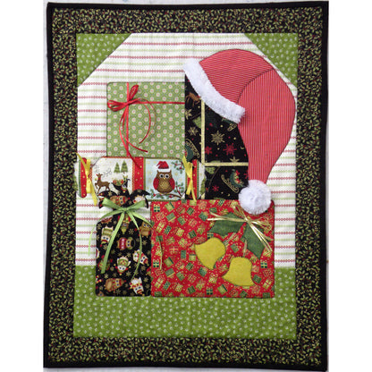 Adorable quilt features a pile of colorfully wrapped gifts with a Santa hat on top.