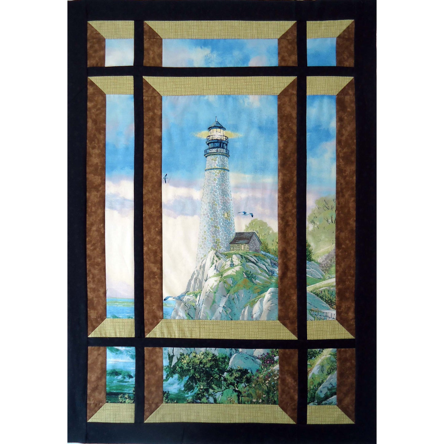 Quilt with a lighthouse scene through a window frame