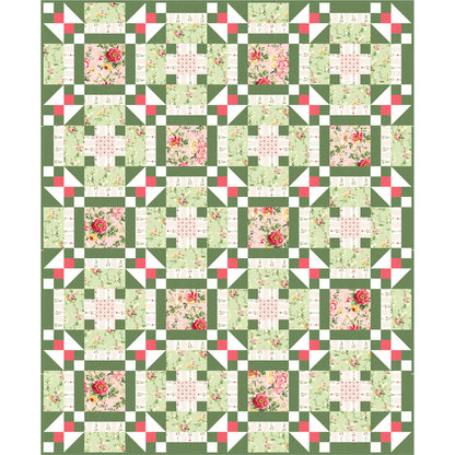 Quilt with floral pattern on a green background