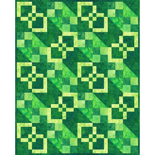 Green quilt with geometric square pattern on a white background
