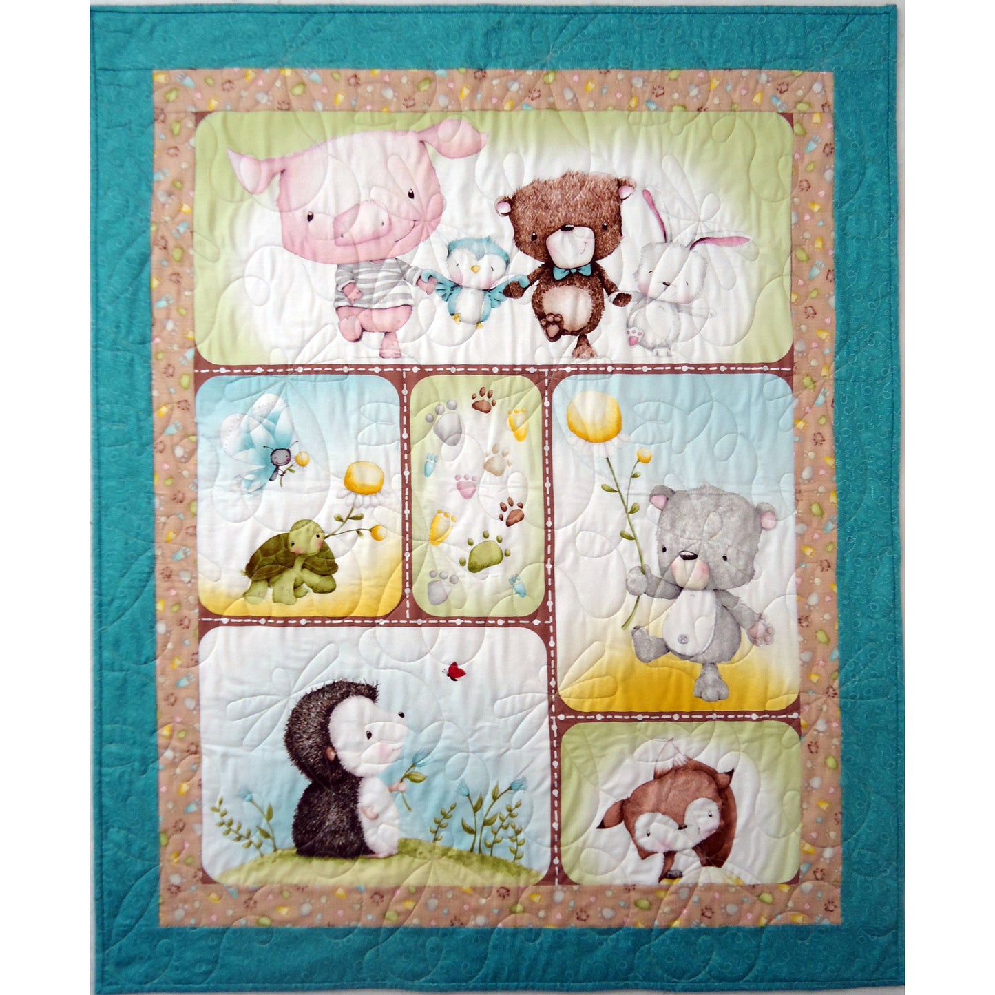 Children's quilt with cartoon animal characters on a teal border