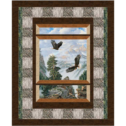 Quilt with a scenic design featuring two eagles flying over a mountain landscape, framed by a stone border.