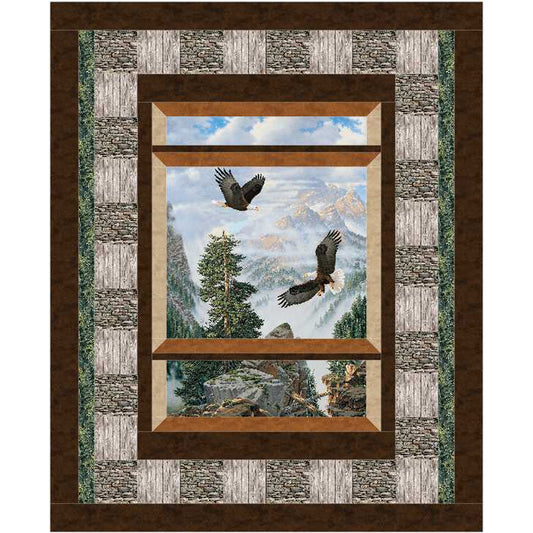 Quilt with a scenic design featuring two eagles flying over a mountain landscape, framed by a stone border.