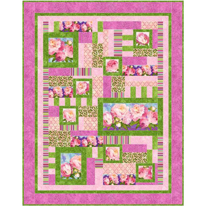 Quilt with floral and geometric patterns on a pink background