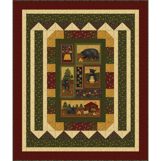 Quilt with bear and cabin design in a geometric pattern