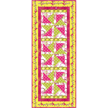 Quilt with colorful geometric table runner pattern on a white background