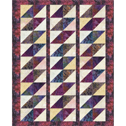 Quilt with geometric triangle pattern in purple, beige, and black on a white background
