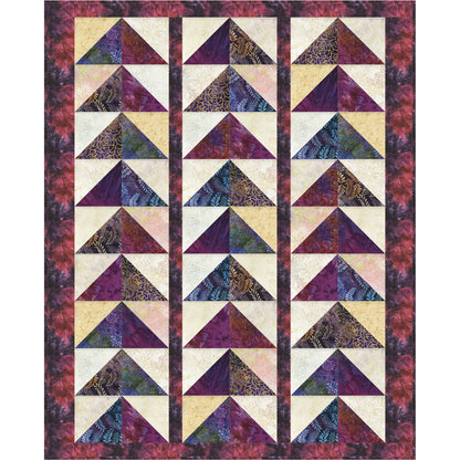 Quilt with triangle pattern in purple, beige, and white on a maroon border