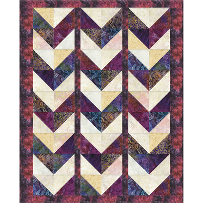 Quilt with chevron pattern in purple, beige, and black on a white background