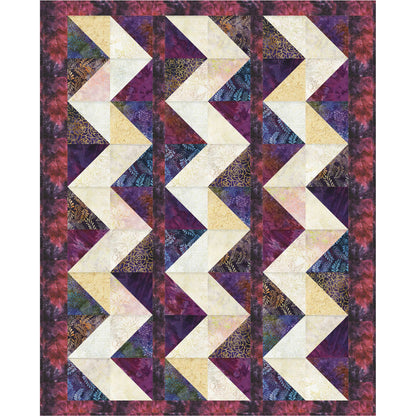 Quilt with chevron pattern in purple, beige, and multicolor fabric on a white background