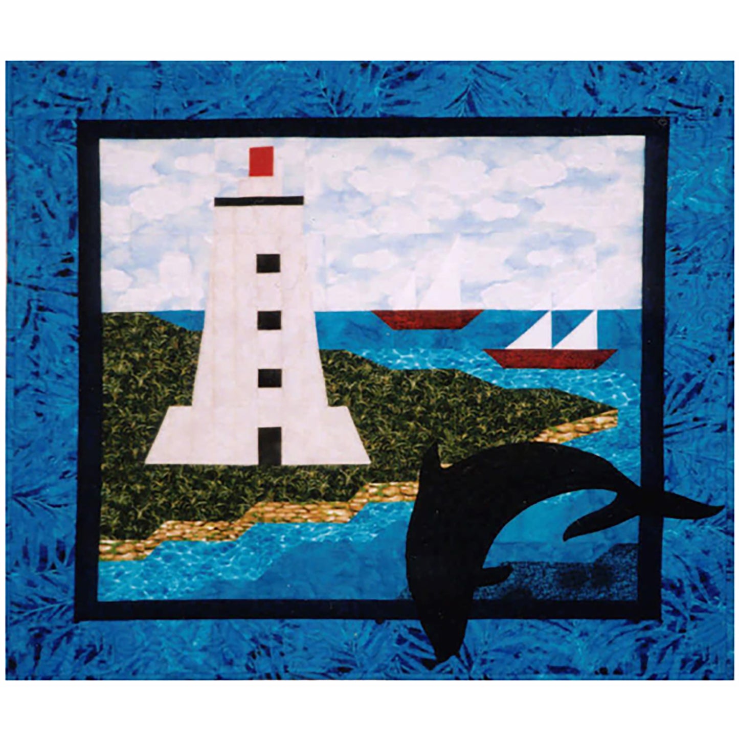Beautiful wall hanging quilt features a lighthouse, playful dolphin and two sail boats in the water.