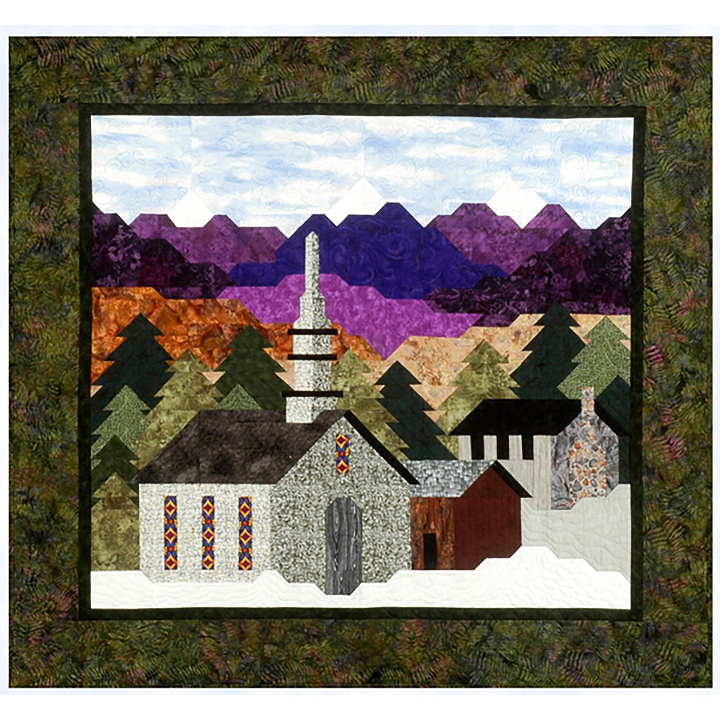 Beautiful quilt is more like a work of art. It features a church and a few other buildings in the snow with pine-trees and mountains in the background.