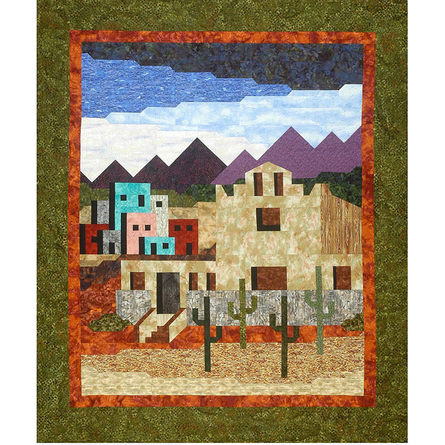 This quilt looks like a Southwest Mission town. There are buildings, mountains, sky and catus.