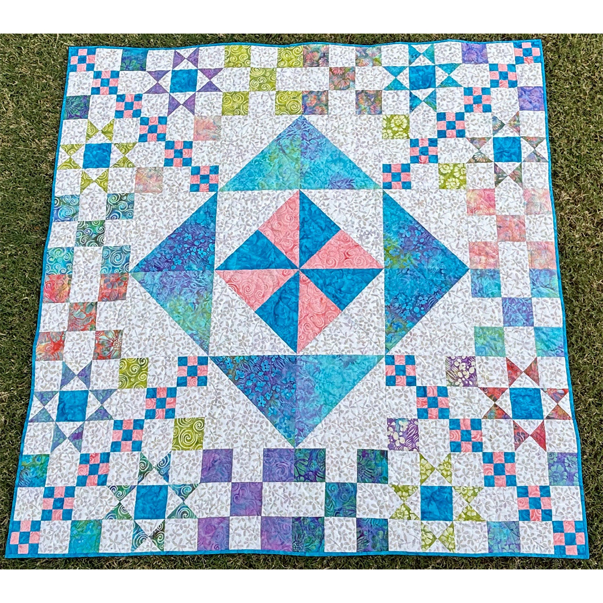 Diamonds in the Rough is a modern sampler quilt featuring five different quilt blocks and two focus fabrics.