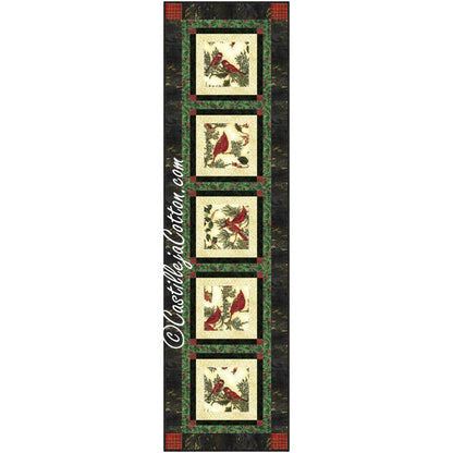 Quilted Christmas-themed table runner featuring five cardinal prints bordered by gold, dark green, and then green and red ivy print with darker print bordering entire table runner.  Festive colors for any holiday or winter gathering.