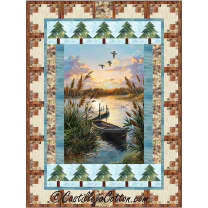 Lakeside quilt features a summer lake panel with pieced tree and log cabin borders.