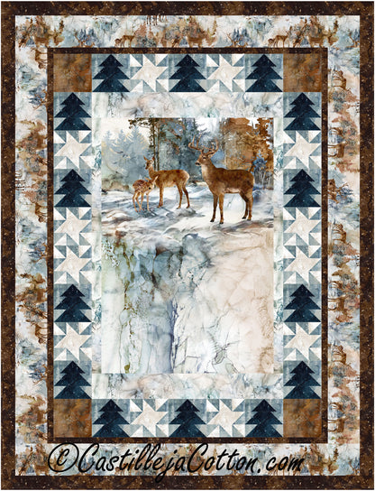 A quilt featuring a design of deer among trees, showcasing a serene woodland scene in soft colors.