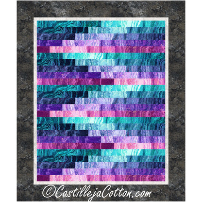 A cozy quilt featuring alternating purple and blue stripes in ombre tones in a Bargello design.