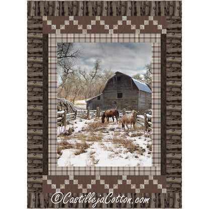 Winter Pasture quilt features a horse panel with horses eating in the snow with two simple pieced borders: staggered irish chain blocks