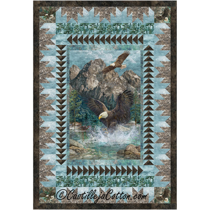 Quilt in neutral colors features a bald eagle landing on some water with another in the sky in front of a mountain. The panel is bordered by flying geese quilt element and then mountains. Beautiful quilt.