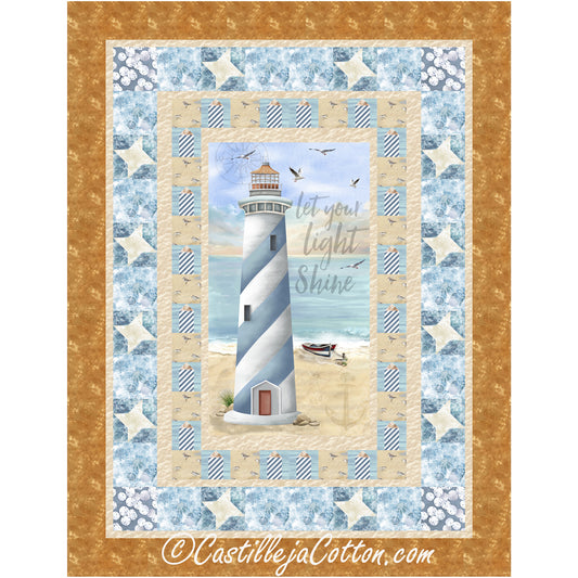 Center fabric panel quilt featuring a lighthouse on a sandy beach surrounded by borders made from simple blocks and pieced stars.