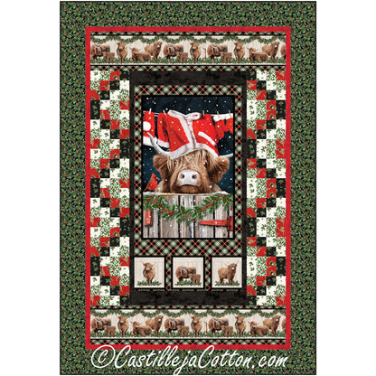 A festive Christmas quilt featuring a highland cow behind a clothes line which has red with white trimmed jack, hat and gloves hanging.