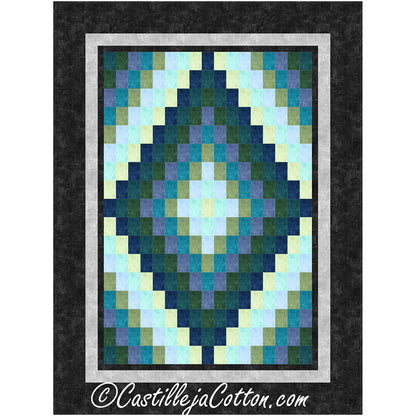 A decorative quilt with an eye-catching blue and green diamond pattern in Bargello style.