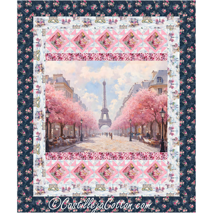 Beautiful Paris in the spring quilt with the Eiffel tower at the end of a street of pink flowering trees.