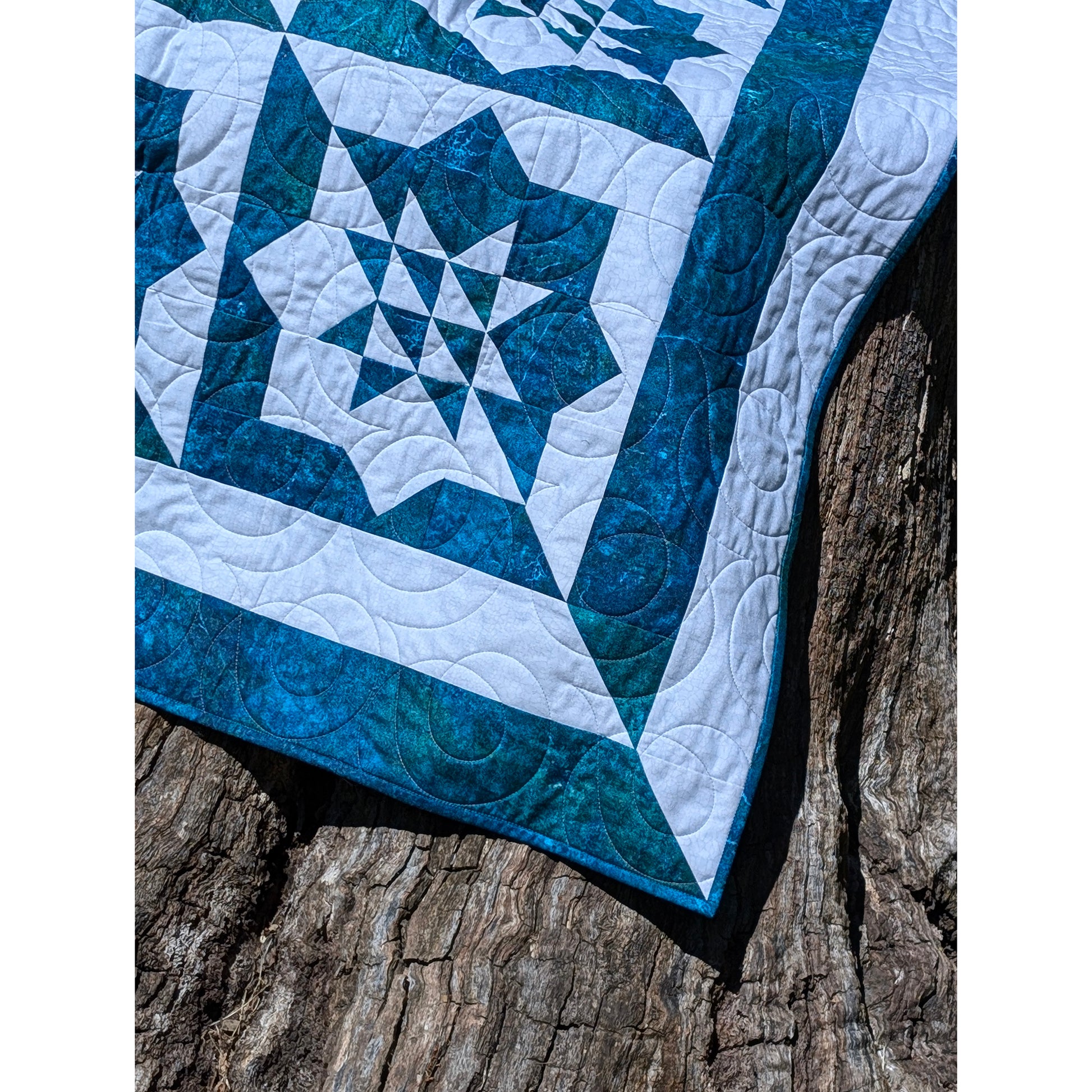 Close up of beautiful quilt star in two shades of blue.