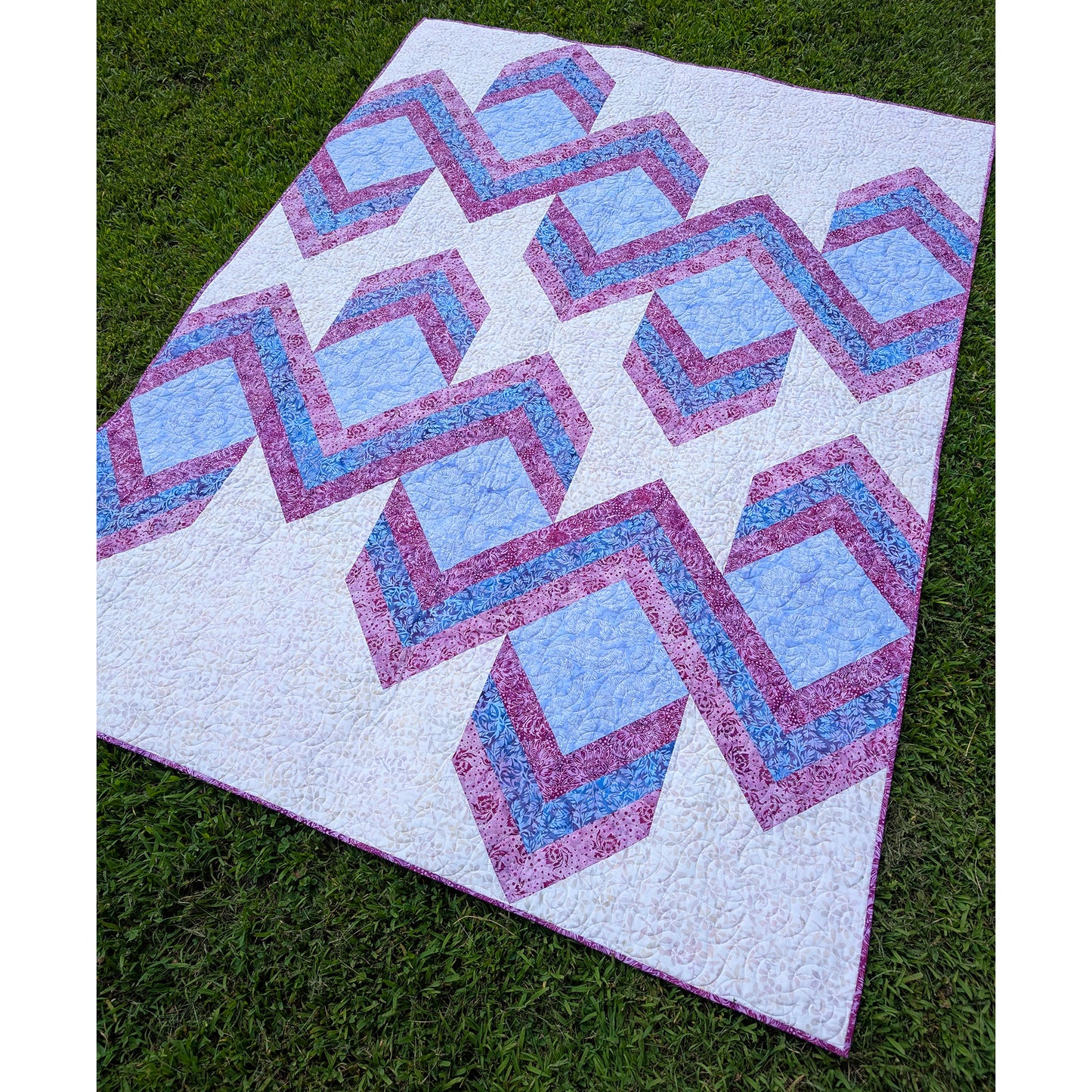 Quilt features ribbons of chevrons to give it a 3-demensional look.