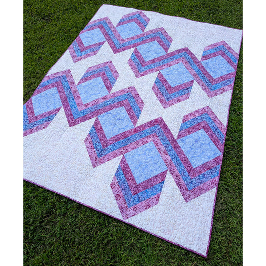 Quilt features ribbons of chevrons to give it a 3-demensional look.