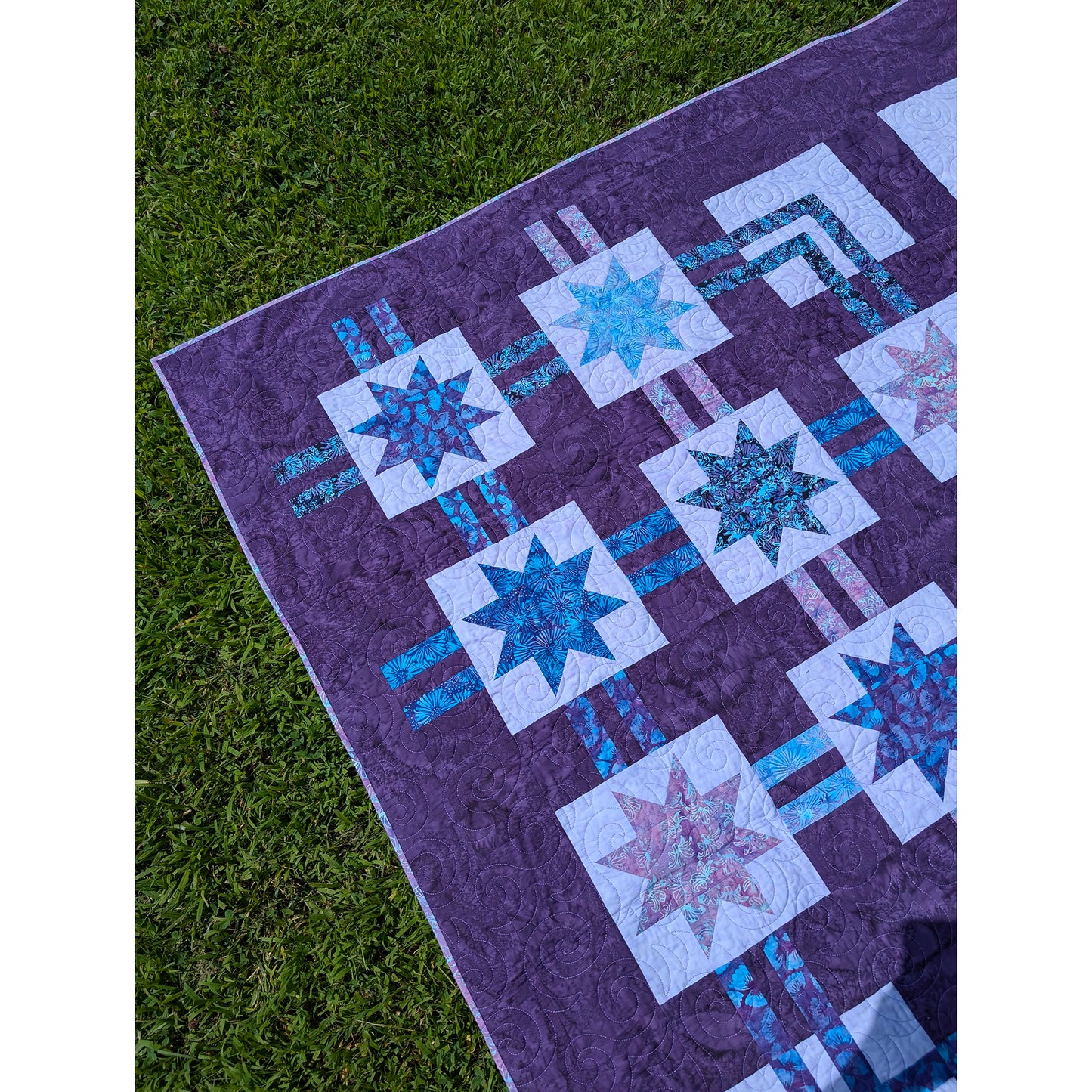 Pretty quilt features blocks of stars and lines between blocks as if it's a flow chart.