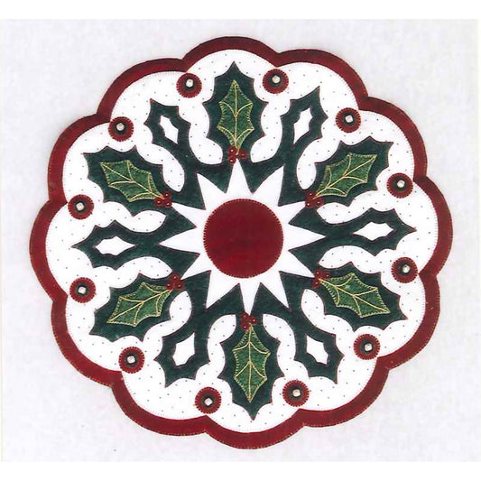 A wonderful winter holiday topper in wool featuring beautiful green holly leaves embellished with embroidery and set against a sparkling beaded background. Little jingle bells around the perimeter add a festive touch.