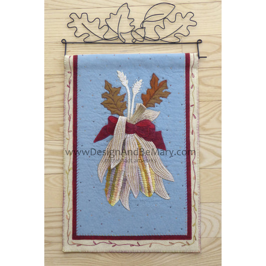 Beautiful mini wall hanging features corn with a couple of leaves bundled together.