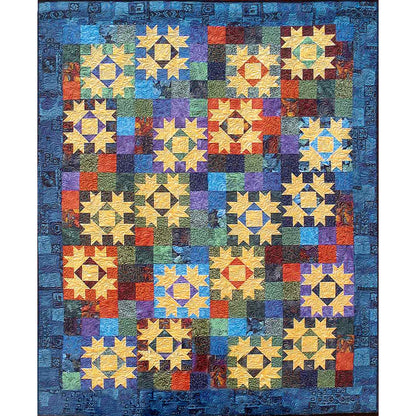 Colorful quilt called The Journey Home by Debbie's Creative Moments with geometric pattern on a blue background.