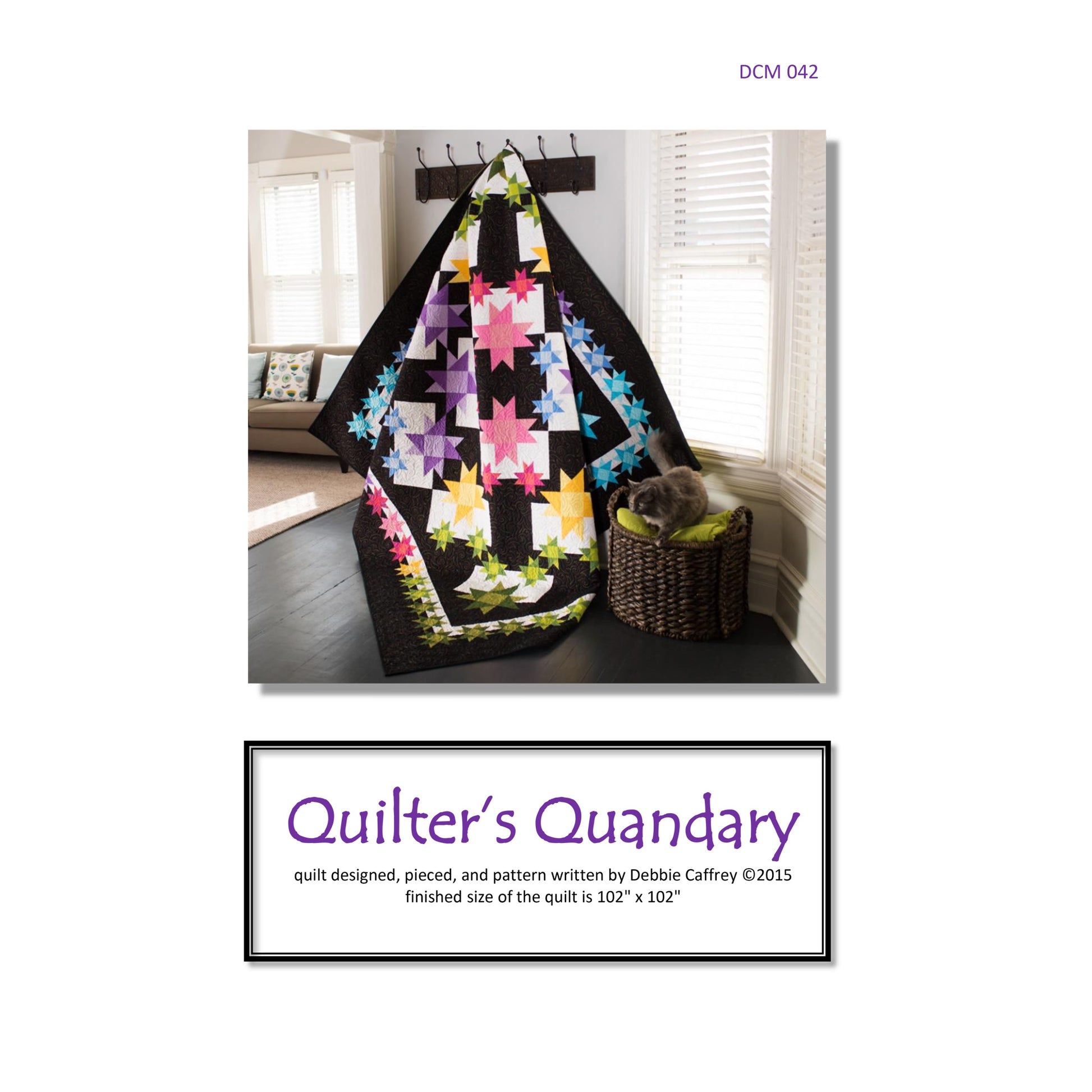 Quilt with star patterns displayed in a room setting, featuring 'Quilter's Quandary' branding.