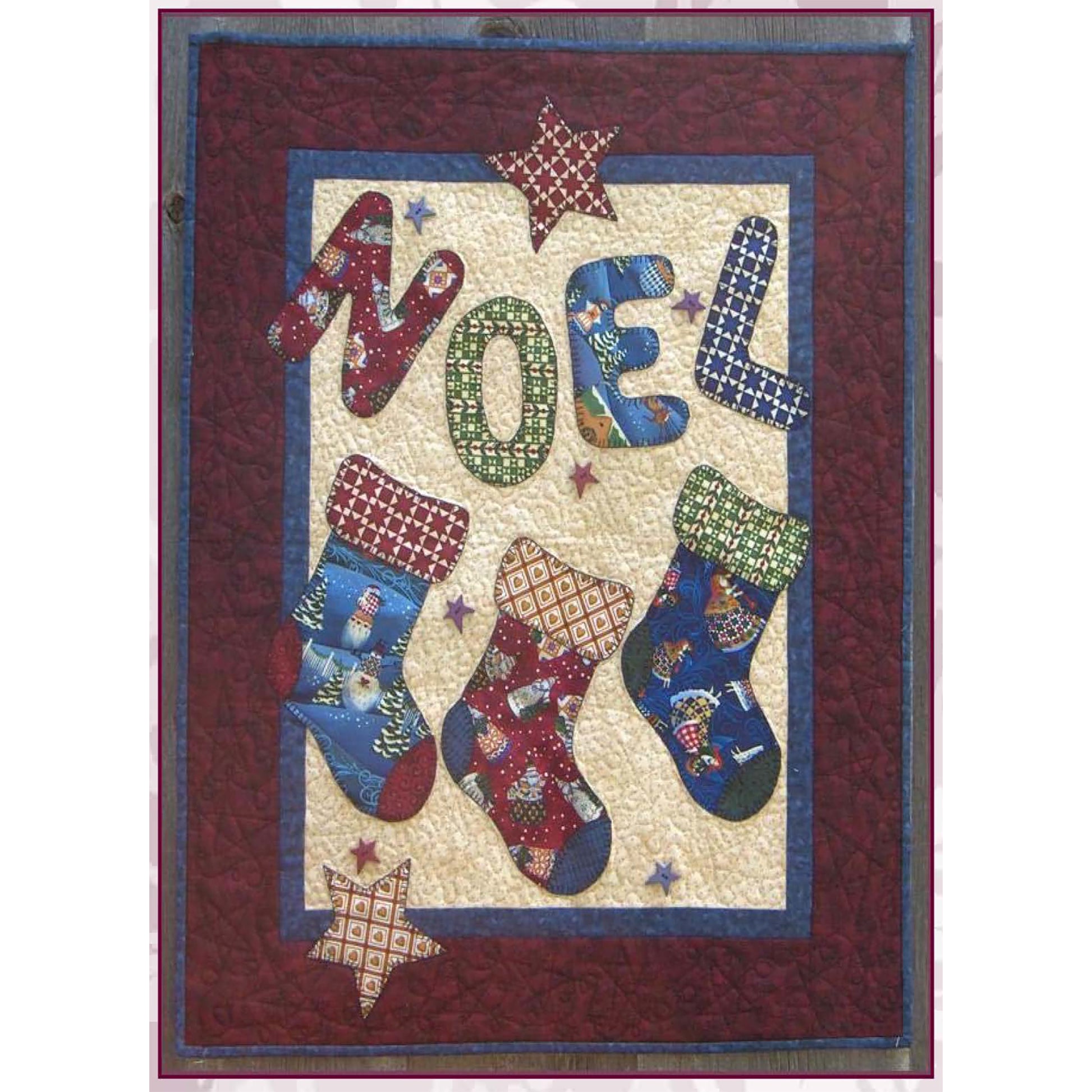 Festive quilt features three stockings in adorable Christmas fabric and matching letters to spell out NOEL on top.