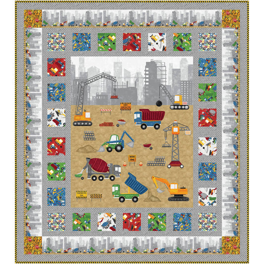 Colorful quilt featuring construction vehicles and trucks that is made from a panel bordered by blocks of fun trucks fabric blocks.