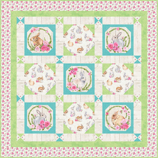 Colorful quilt featuring a cute bunny surrounded by vibrant flowers with frames in green and turquoise.