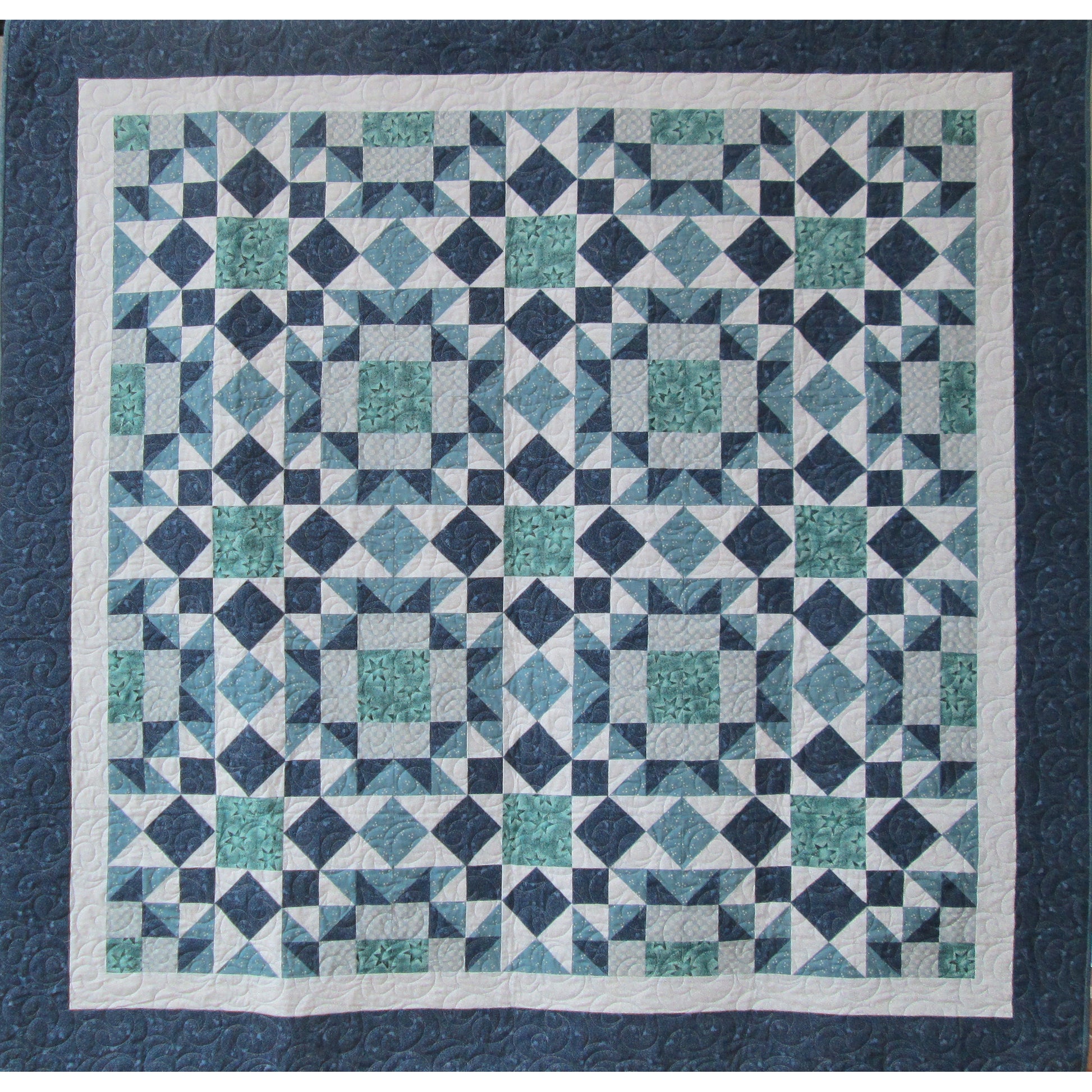 Fun stars, squares and diamonds quilt in blues and greens.