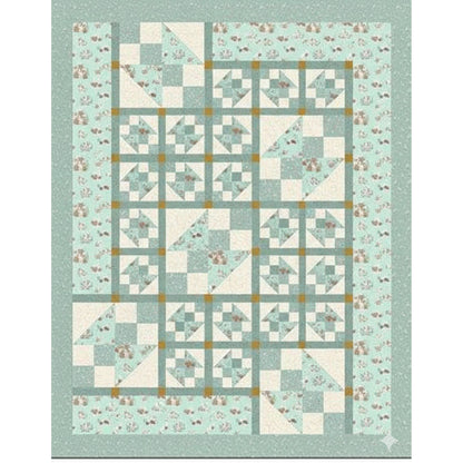 Quilt with geometric pattern on a light blue background