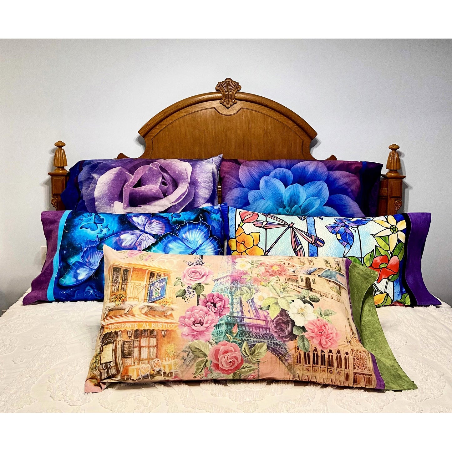 Headboard of bed with five pillows with beautiful cases. Such a beautiful way to sleep every night!