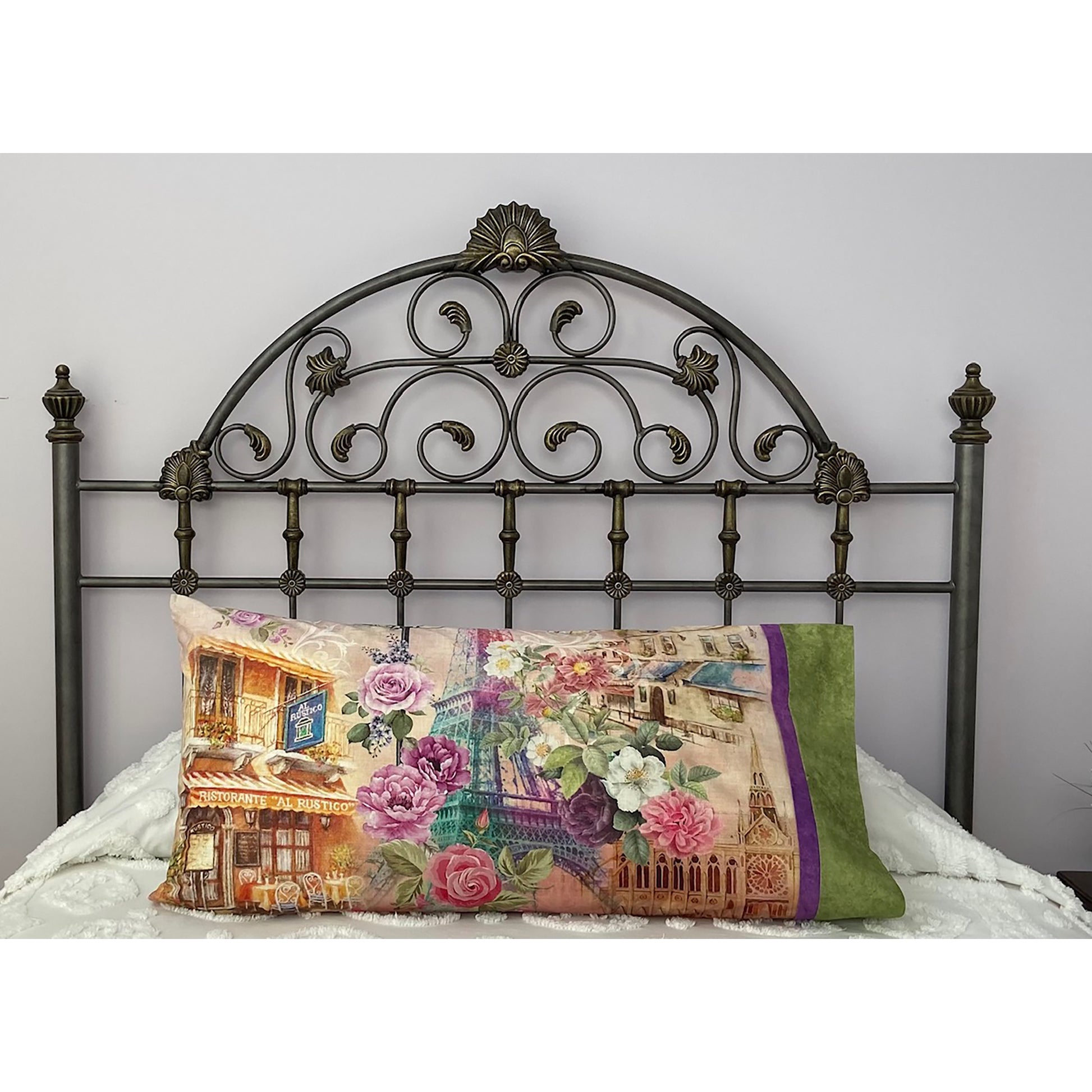 Pillow on a bed with pillowcase showcasing a Paris and flowers fabric.