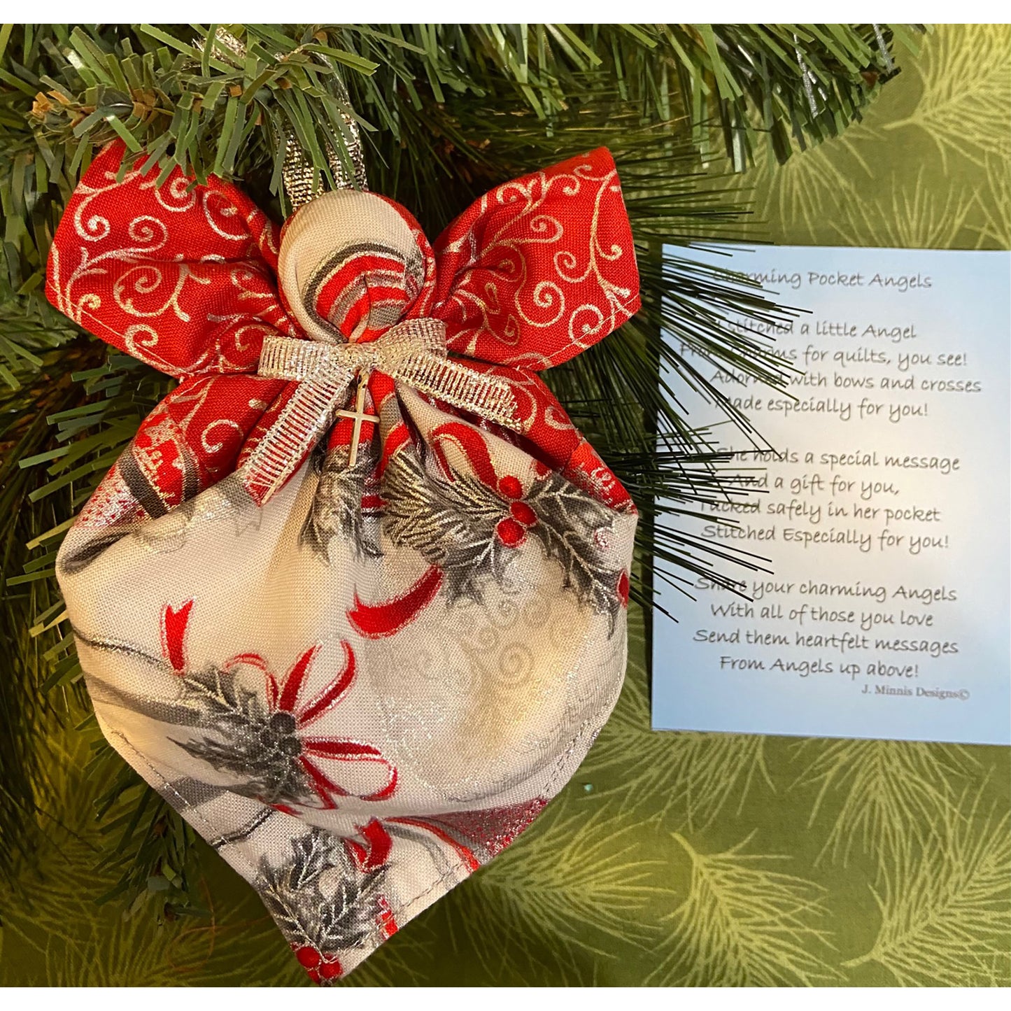 Adorable angel ornament hanging in a tree with poem next to it.