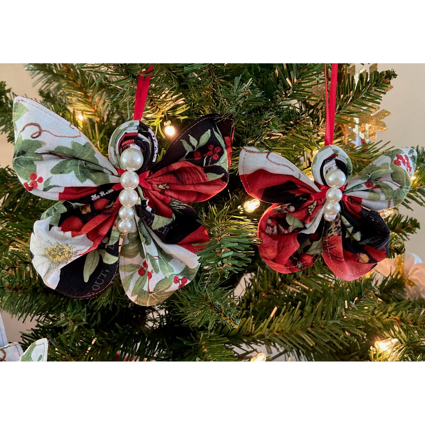 Two beautiful Christmas colored butterfly ornaments. One is slightly smaller than the other. Includes beads in the middle for the butterfly body.