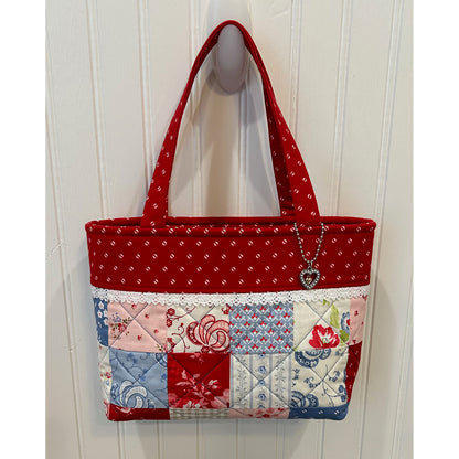 This is the cutest little tote bag using a mini charm pack!  Shown with red fabric top and matching charms.