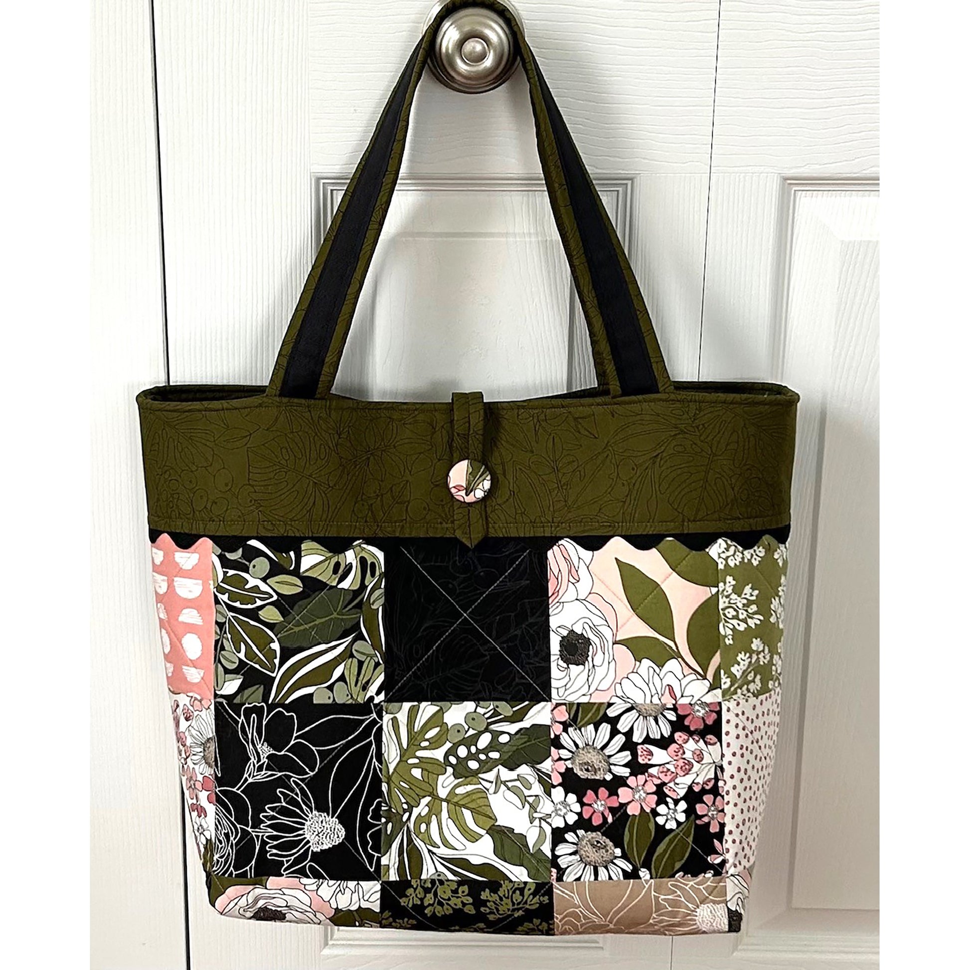 Adorable tote bag using a Charm Pack. It has a back zippered pocket to hold all your treasures. Floral fabrics shown in example with greens and some pink.