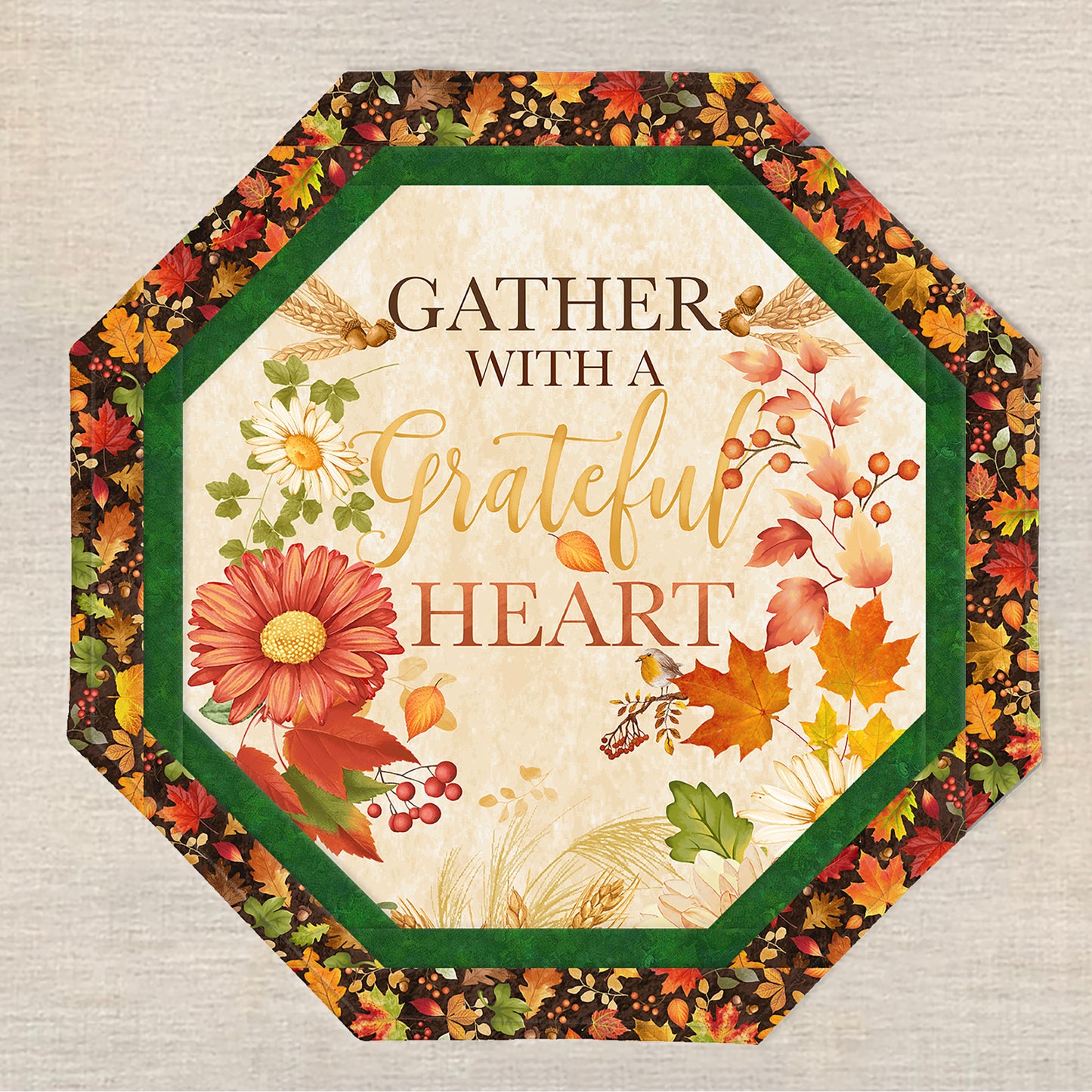 Octagon table topper features a print with fall leaves and flowers and saying "Gather with a grateful heart".