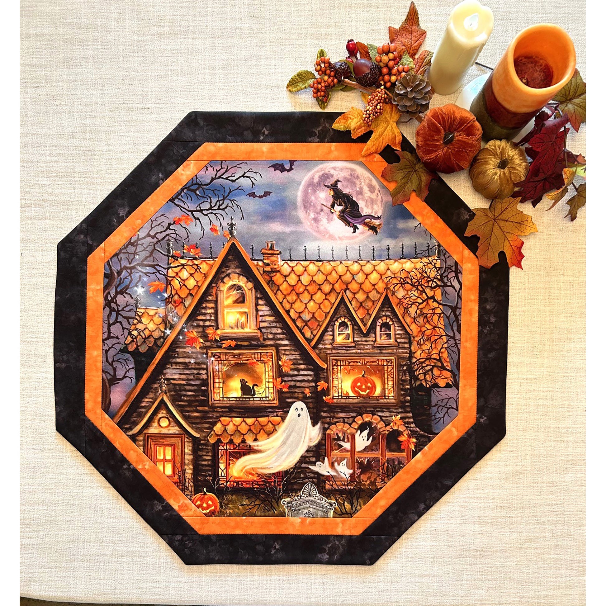 Octagon table topper features a print with a haunted house print.